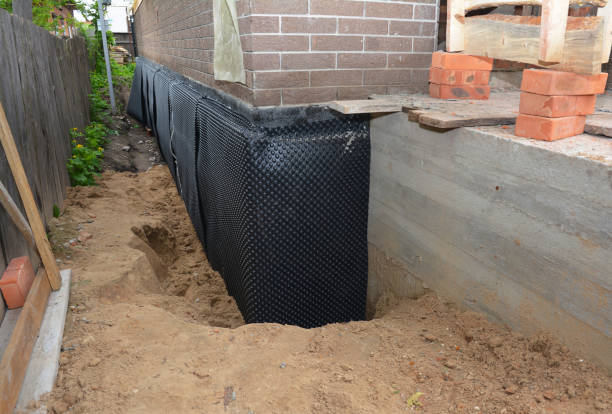 SJ Waterproofing Pros technician performing targeted Sump Pump Installation assessment in Aurora, OH